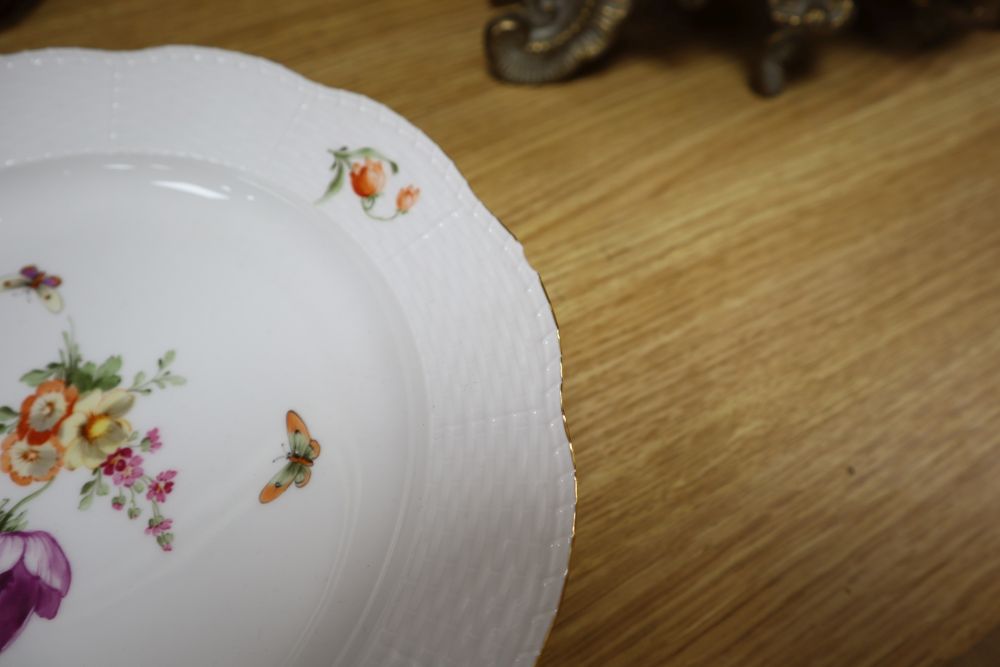 A set of eight Berlin plates, decorated with butterflies and flowers, diameter 21cm (5) and 24cm (3)
